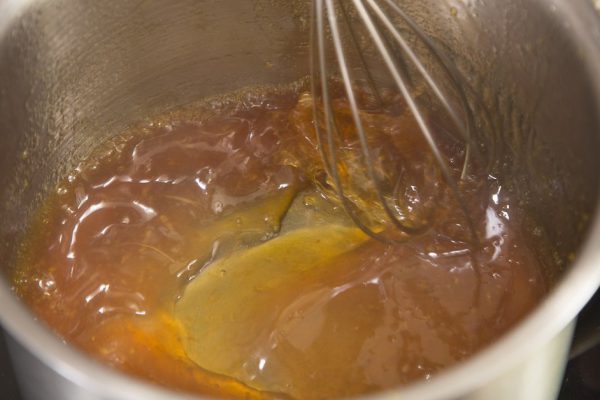 The process of making jelly from natural fruits. Heated fresh citrus fruit juice with sugar and agar.