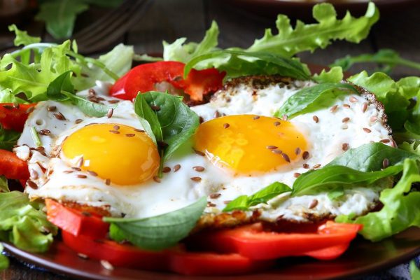 fried eggs with herbs and paprika for breakfast, food