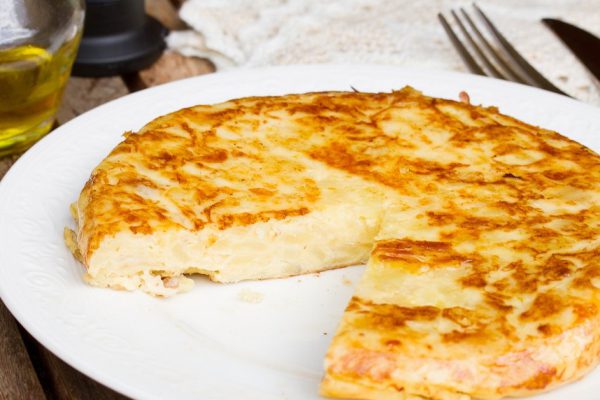 tortilla  - spanish omelette close up, served on wooden table