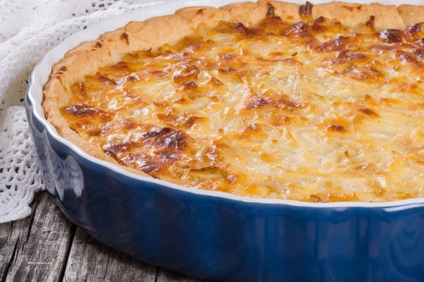 French onion quiche  or pie in a gratin dish, traditional recipe, view from above