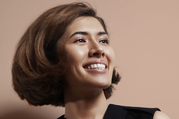 happy shiny asian woman with a short hair