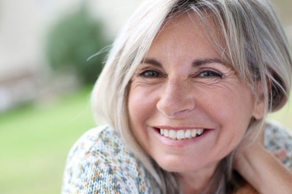 Portrait of serene mature woman in garden
