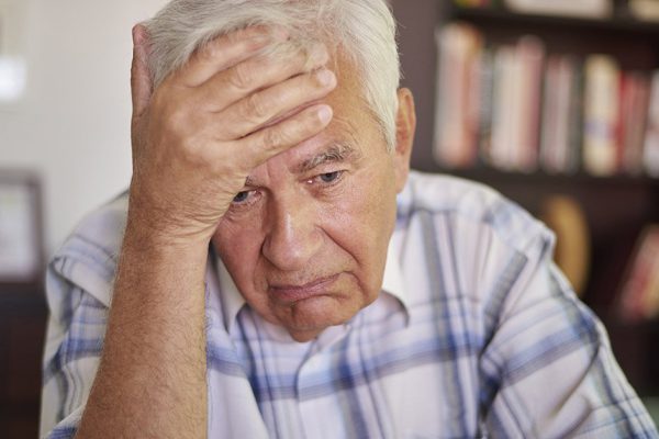 Thoughtful senior man in the living room