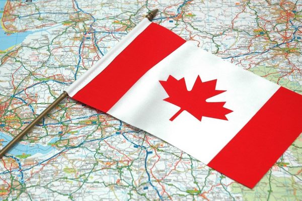 Flag of Canada over the map