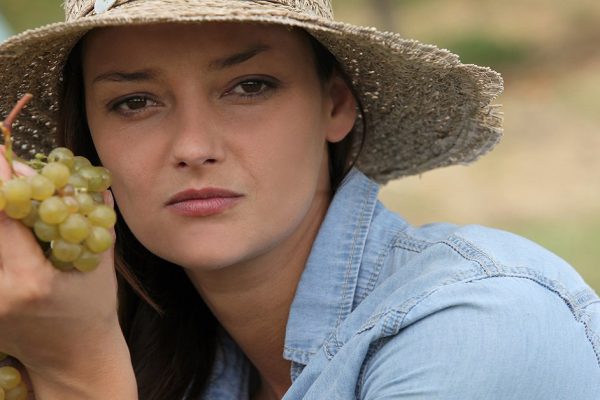 Woman holding grapes