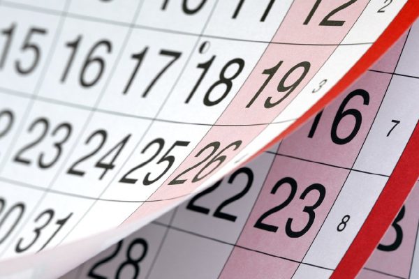 Months and dates shown on a calendar whilst turning the pages