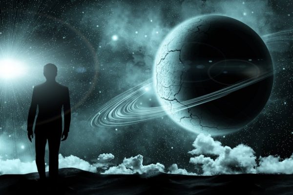 man standing on the background of the cosmic landscape